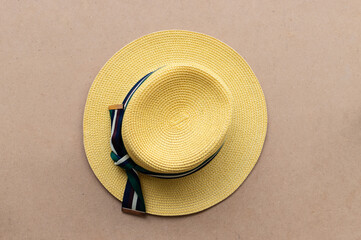Fototapeta na wymiar Top view of travel hat on wooden background, concept of summer holiday.