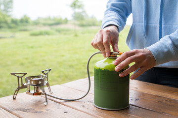 cooking in the campsite with a gas burner and gas cylinder