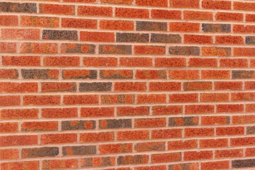 Obraz premium Vintage red and brown peppered look clay brick wall background