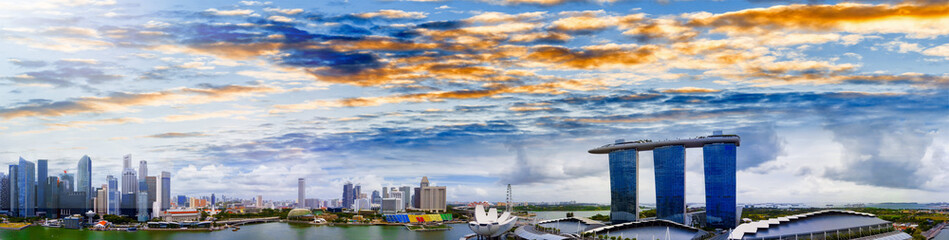 Fototapeta premium Singapore skyline. Amazing aerial panoramic view of Marina Bay area at sunset