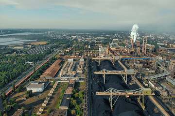Aerial view of huge Metallurgical Plant, smokestacks and chimneys with smoke. Environmental pollution from petrochemical production industrial factory.