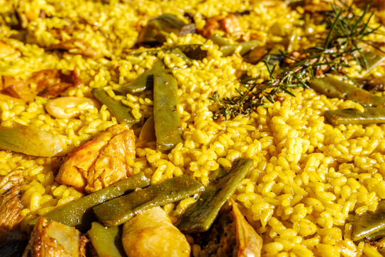 Detail of a yellow paella, Mediterranean rice from the gastronomy of Spain.