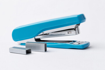 Blue stapler on a white background.