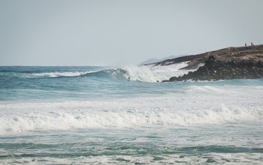 waves crashing on rocks