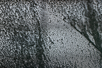 abstract of soap on the windshield in a car wash