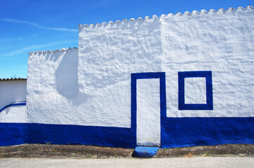 white and blue house in portuguese village
