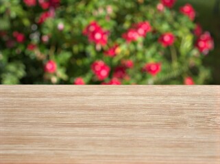 Empty wood table top on blur green leaves flower garden background ,nature abstract blurred, display product, balnk table	