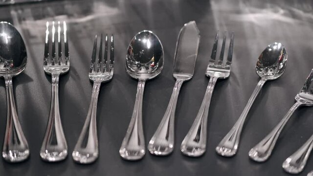 A close view of silver cutlery set on the table. This is the range sold at the tableware store.