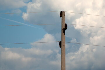 electricity pylon against blue sky