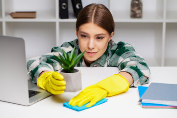 An employee of the cleaning company fulfills orders for office cleaning