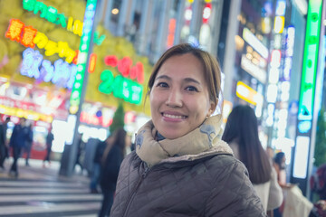 portrait of a young attractive woman smiling in the city