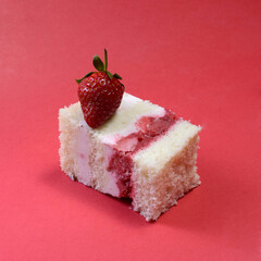 peace of strawberry cake on pink background