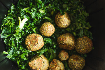plant-based food, falafels and kale chips in air fryer