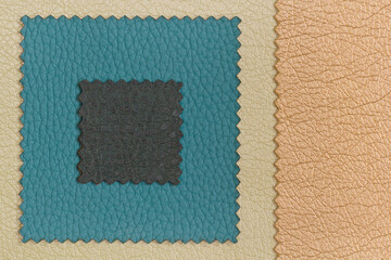 Background frame from samples of furniture leather crumpled structure of blue, brown and golden color in macro with copy space. Frame from factory furniture leather with a place for text.