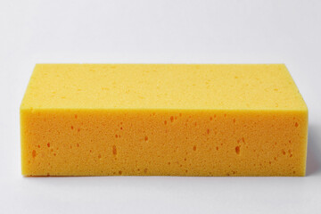 Yellow sponge on white background