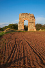 Ruins of the ancient aqueduct near Villa Quintili on Appia Way in Rome, Italy