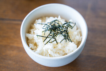 cooked japanese rice with seaweed and sesame