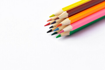 Color pencils on white background.Close up.