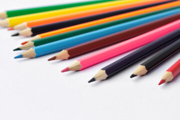 Color pencils on white background.Close up.