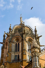 Mumbai India Nov 9th 2019: The symbol of Progress statue on the top of dome of train station "Chhatrapati Shivaji Maharaj Terminus" , a historic terminal train station and UNESCO World Heritage Site. 