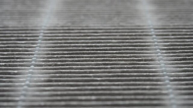 Very dirty air filter,  manual focusing from front to back showing close up of texture of the filter