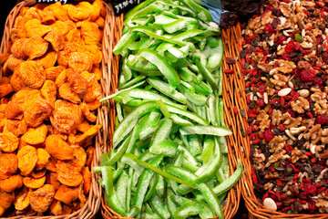 Colourful display of various candied fruits, and mixed nuts for sale at La Boqueria market in Barcelona