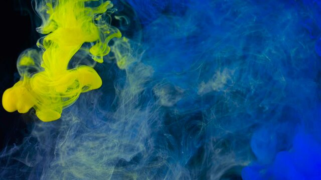 Smoky splash of color in water. Stock footage. Colored ink or acrylic paint in water creates beautiful smoky shapes. Underwater art