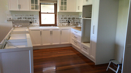 Total renovation of a kitchen with new cupboards, tiles, bench top and appliances