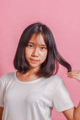 Fototapeta premium Young girl asian thailand pink background