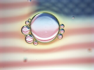 Beautiful bubbles oil with colorful white pink background ,dropslets macro image ,abstract background, sweet pastel color for card design, USA flag