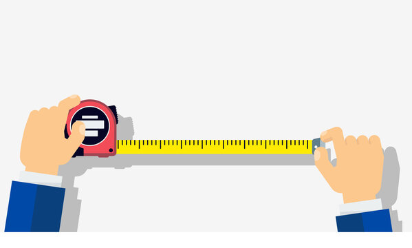 Measuring tape in the hands of a man.