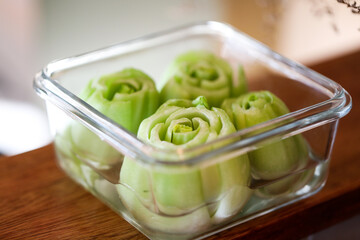 Pak choy stems in water on kitchen bench to regrow for home vegetable garden