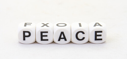 The term peace displayed visually on a clear background in black text image with copy space in...