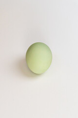 Multicolored village chicken eggs on a white background