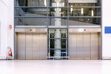Modern Elevator Doorway of Facility Office Building, Architecture Interior Decoration of Electronic Elevators in Buildings Entrance. Metallic Facade Decorative Building of Lift Door