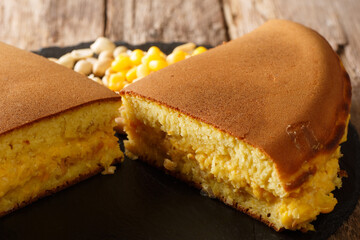 Apam balik or terang bulanor martabak manis is a dessert common in many varieties at specialist roadside stalls throughout Brunei, Indonesia, Malaysia and Singapore close-up. Horizontal