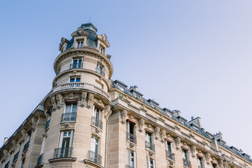 Rooftop and facade of the parisian apartment building on a beautiful day