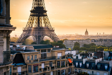 Eiffel Tower with light rays during a sunrise morning, France