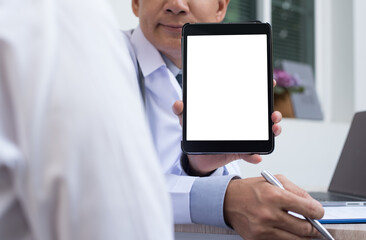 Mockup image of male doctor show blank screen digital tablet to patient