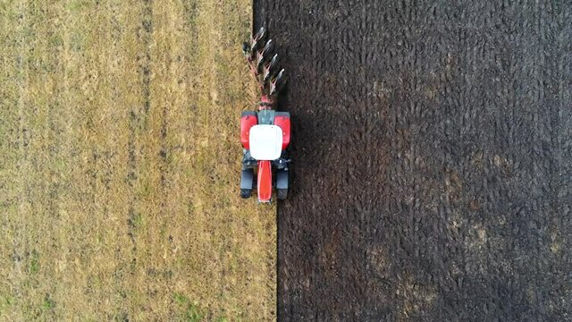 Aerial of tractor plowing a field