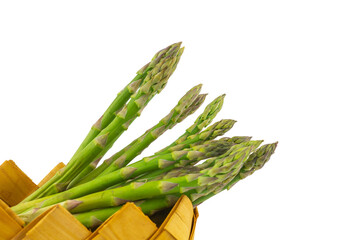 Fresh green asparagus in a rustic woven basket