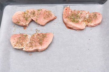 raw pork chops. fresh raw meat with spices