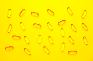 Fish oil capsules on color background