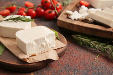 Tasty feta cheese on color background