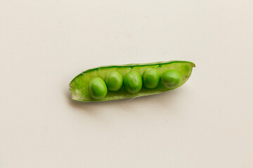 Green fresh peas isolated on white top view.