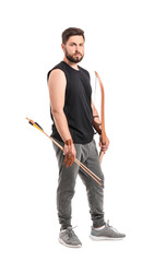 Handsome man with crossbow on white background