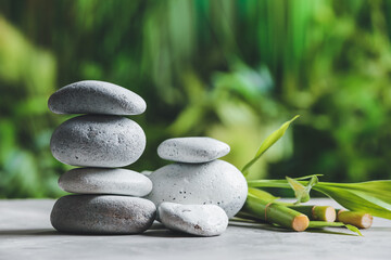 Stack of zen stones on table outdoors
