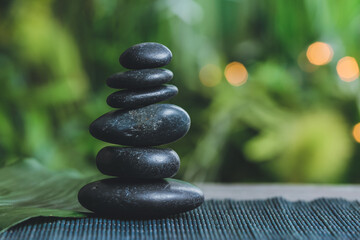 Obraz na płótnie Canvas Stack of zen stones on table outdoors