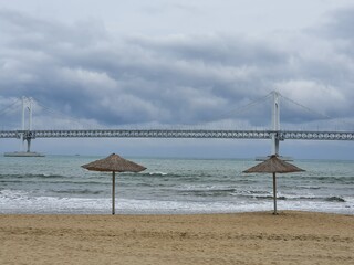  Beautiful beach and bridge overlooking cloudy day