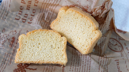 2 pieces Almond slice bread on newspaper paper
